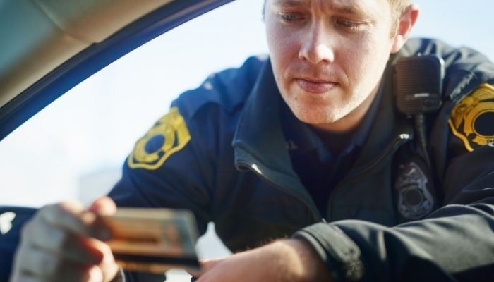 Officer Looking at License